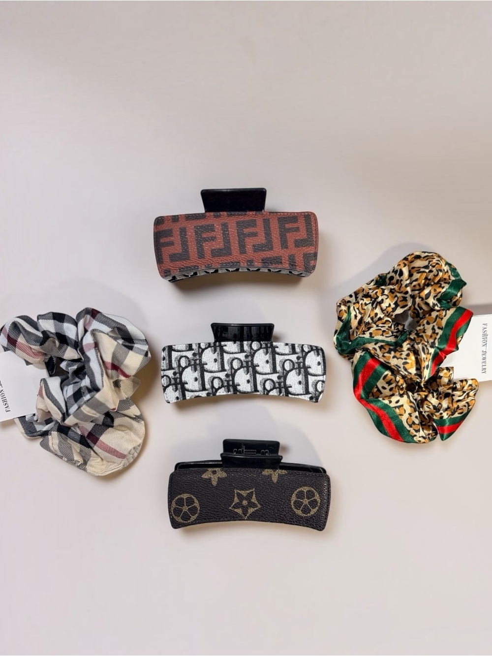 7-piece hair-accessory bundle: three logo claw clips and four petite scrunchies